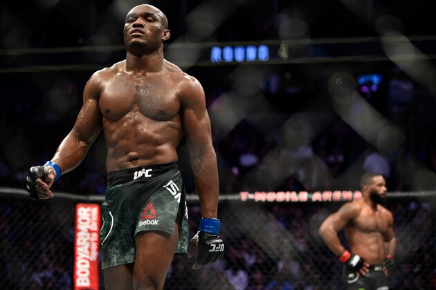 LAS VEGAS, NEVADA - MARCH 02:  (L-R) Kamaru Usman of Nigeria walks back to his corner after the fourth round of his welterweight championship bout against Tyron Woodley during the UFC 235 event at T-Mobile Arena on March 2, 2019 in Las Vegas, Nevada. (Photo by Chris Unger/Zuffa LLC/Zuffa LLC via Getty Images)