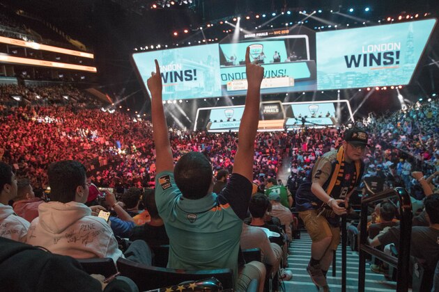 London Spitfire fan Rick Ybarra, of Plainfield, Ind., reacts after London won the second game against the Philadelphia Fusion during the Overwatch League Grand Finals competition, Saturday, July 28, 2018, at Barclays Center in the Brooklyn borough of New York. (AP Photo/Mary Altaffer)