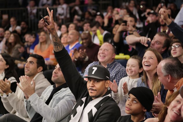 Former New York Knick Carmelo Anthony acknowledges the crowd during the first half of the NBA basketball game between the New York Knicks and the Miami Heat, Sunday, Jan. 27, 2019, in New York. (AP Photo/Seth Wenig)