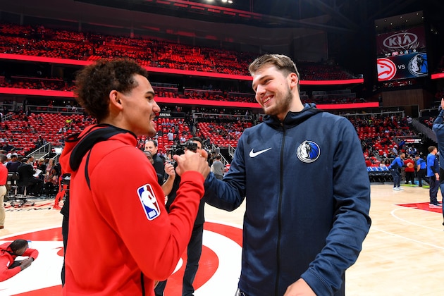 ATLANTA, GA - OCTOBER 24: Trae Young #11 of the Atlanta Hawks and Luka Doncic #77 of the Dallas Mavericks talk before the game on October 24, 2018 at State Farm Arena in Atlanta, Georgia. NOTE TO USER: User expressly acknowledges and agrees that, by downloading and/or using this photograph, user is consenting to the terms and conditions of the Getty Images License Agreement. Mandatory Copyright Notice: Copyright 2018 NBAE (Photo by Scott Cunningham/NBAE via Getty Images)