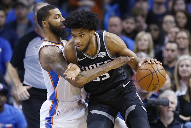 Sacramento Kings forward Marvin Bagley III (35) drives against Oklahoma City Thunder forward Markieff Morris (5) during an NBA basketball game, Saturday, Feb. 23, 2019, in Oklahoma City. (AP Photo/Sue Ogrocki)