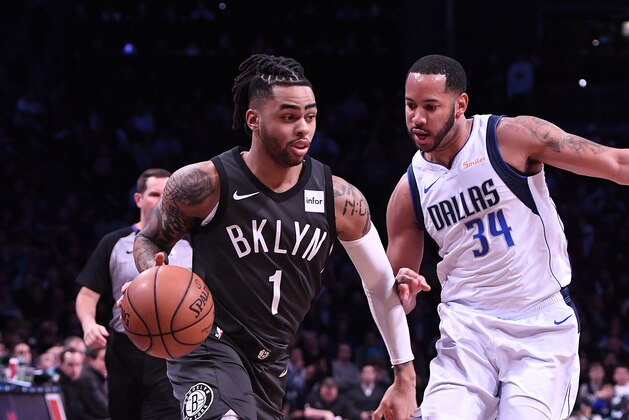 NEW YORK, NY - MARCH 04: D'Angelo Russell #1 of the Brooklyn Nets drives to the basket against Devin Harris #34 of the Dallas Mavericks during the game at Barclays Center on March 04, 2019 in the Brooklyn borough of New York City. NOTE TO USER: User expressly acknowledges and agrees that, by downloading and or using this photograph, User is consenting to the terms and conditions of the Getty Images License Agreement. (Photo by Matteo Marchi/Getty Images)