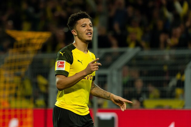 DORTMUND, GERMANY - FEBRUARY 24: Jadon Sancho of Borussia Dortmund celebrates after scoring his team's second goal during the Bundesliga match between Borussia Dortmund and Bayer 04 Leverkusen at Signal Iduna Park on February 24, 2019 in Dortmund, Germany. (Photo by TF-Images/Getty Images)
