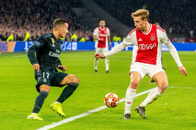 Lucas Vazquez of Real Madrid, Frenkie de Jong of Ajax during the UEFA Champions League round of 16 match Ajax Amsterdam and Real Madrid at the Johan Cruijff Arena on February 13, 2019 in Amsterdam, The Netherlands(Photo by VI Images via Getty Images)