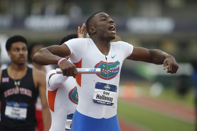 Florida's Grant Holloway celebrates after realizing that the team had won the men's team championship on the third day of the NCAA outdoor college track and field championships in Eugene, Ore., Friday, June 9, 2017. (AP Photo/Timothy J. Gonzalez)