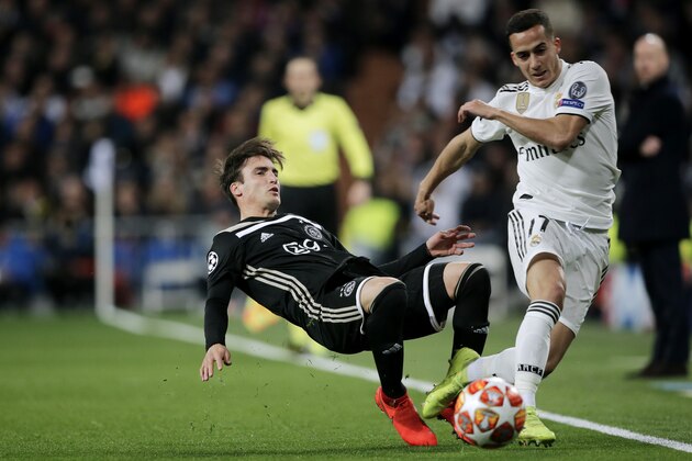 MADRID, SPAIN - MARCH 5: (L-R) Nicolas Tagliafico of Ajax, Lucas Vazquez of Real Madrid  during the UEFA Champions League  match between Real Madrid v Ajax at the Santiago Bernabeu on March 5, 2019 in Madrid Spain (Photo by Erwin Spek/Soccrates/Getty Images)