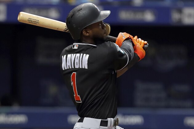 Miami Marlins' Cameron Maybin follows through on a solo home run during the seventh inning of a baseball game against the Tampa Bay Rays, Saturday, July 21, 2018, in St. Petersburg, Fla. (AP Photo/Mike Carlson)