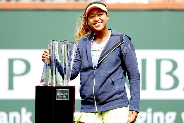 INDIAN WELLS, CA - MARCH 18:  Naomi Osaka of Japan poses with the winner's trophy after defeating Daria Kasatkina of Russia during the women's final on Day 14 of the BNP Paribas Open at the Indian Wells Tennis Garden on March 18, 2018 in Indian Wells, California.  (Photo by Matthew Stockman/Getty Images)