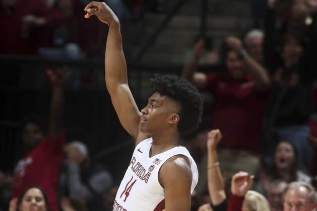 Florida State guard Terance Mann (14) reacts after making a 3-point shot to take the lead in the second half of an NCAA college basketball game against Virginia Tech in Tallahassee, Fla., Tuesday, March 5, 2019. Florida State won 73-64 in overtime. (AP Photo/Phil Sears)