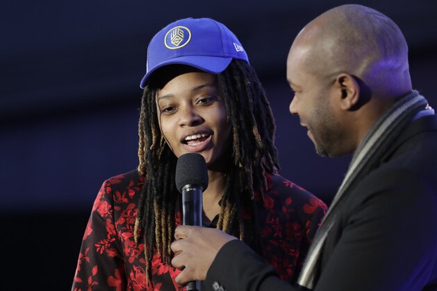 Chiquita Evans responds to questions after being selected as the 56th pick overall by the Warriors Gaming Squad at the NBA 2K League draft Tuesday, March 5, 2019, in New York. Evans is the first woman selected in the esports league. (AP Photo/Frank Franklin II)