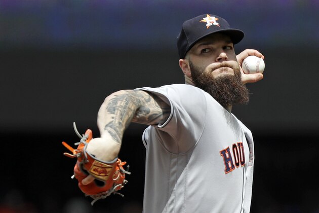 Houston Astros starting pitcher Dallas Keuchel throws against the Seattle Mariners in the first inning of a baseball game Wednesday, Aug. 1, 2018, in Seattle. (AP Photo/Elaine Thompson)