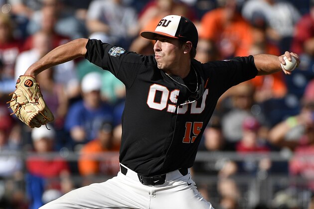 Oregon State pitcher Luke Heimlich throws against Arkansas during the first inning of Game 1 of the NCAA College World Series baseball finals in Omaha, Neb., Tuesday, June 26, 2018. (AP Photo/Ted Kirk)