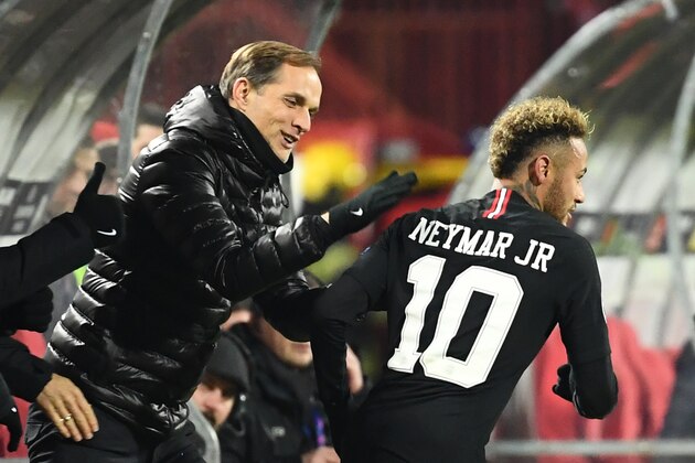 Paris Saint-Germain's Brazilian forward Neymar (C) is congratulated by Paris Saint-Germain's German coach Thomas Tuchel after scoring a goal during the European Champions League football match Crvena Zvezda Belgrade vs Paris Saint-Germain (PSG) on December 11, 2018 at Rajko-Mitic stadium in Belgarde. (Photo by FRANCK FIFE / AFP)        (Photo credit should read FRANCK FIFE/AFP/Getty Images)