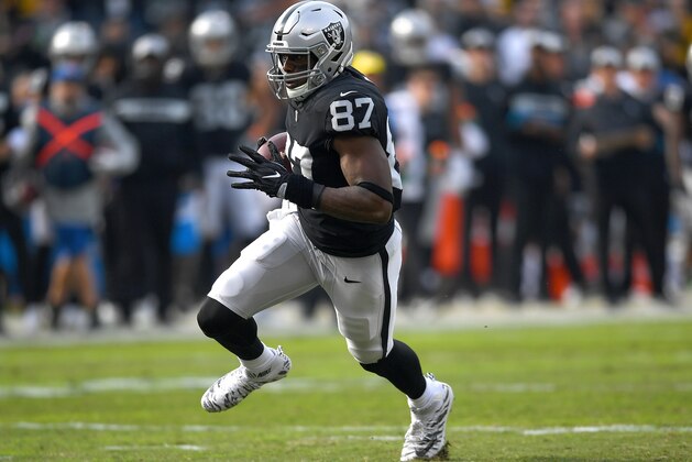 OAKLAND, CA - DECEMBER 09:  Jared Cook #87 of the Oakland Raiders runs with the ball after catching a pass against the Pittsburgh Steelers during the first half of an NFL football game at Oakland-Alameda County Coliseum on December 9, 2018 in Oakland, California.  (Photo by Thearon W. Henderson/Getty Images)