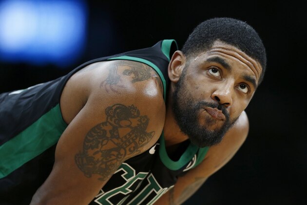 Boston Celtics' Kyrie Irving stands on the court during a stoppage in play during the second half of an NBA basketball game against the Houston Rockets in Boston, Sunday, March 3, 2019. (AP Photo/Michael Dwyer)