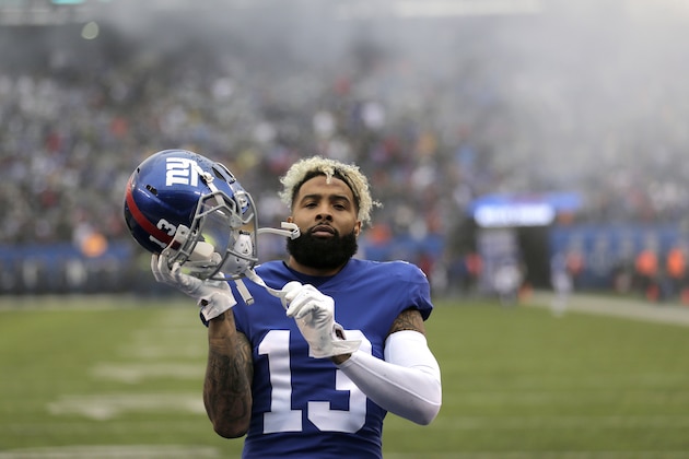New York Giants wide receiver Odell Beckham adjusts his helmet before putting it on prior to an NFL football game against the Chicago Bears, Sunday, Dec. 2, 2018, in East Rutherford, N.J. (AP Photo/Seth Wenig)