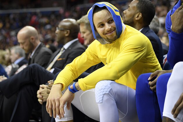 Golden State Warriors guard Stephen Curry smiles on the bench during the first half of the team's NBA basketball game against the Washington Wizards, Thursday, Jan. 24, 2019, in Washington. (AP Photo/Nick Wass)