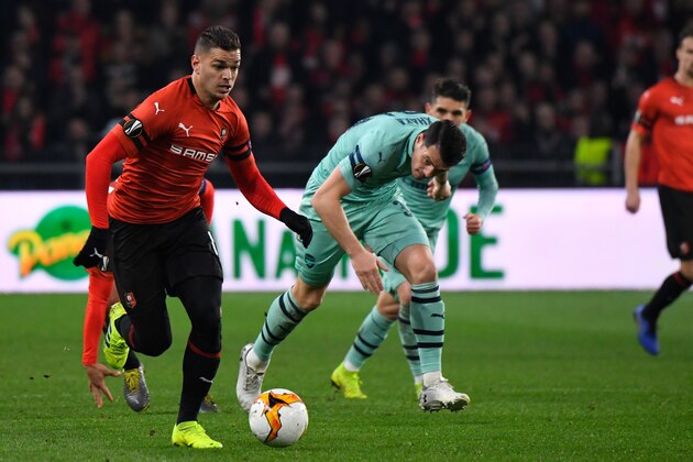 Rennes' French forward Hatem Ben Arfa (L) vies with Arsenal's Swiss midfielder Granit Xhaka during the UEFA Europa League round of 16 first leg football match between Stade Rennais FC and Arsenal FC at the Roazhon Park stadium in Rennes, northwestern France on March 7, 2019. (Photo by DAMIEN MEYER / AFP)        (Photo credit should read DAMIEN MEYER/AFP/Getty Images)