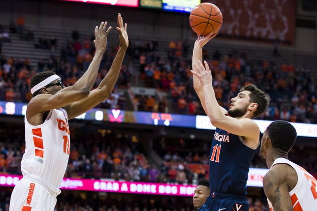 SYRACUSE, NY - MARCH 04:  Ty Jerome #11 of the Virginia Cavaliers shoots the ball against Paschal Chukwu #13 of the Syracuse Orange during the first half at the Carrier Dome on March 4, 2019 in Syracuse, New York. Virginia defeats Syracuse 79-53.  (Photo by Brett Carlsen/Getty Images)