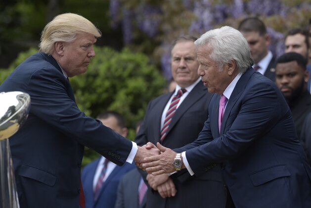 President Donald Trump shakes hands with New England Patriots owner Robert Kraft, accompanied by head coach Bill Belichick, center, during a ceremony on the South Lawn of the White House in Washington, Wednesday, April 19, 2017, where the president honored the Super Bowl Champion New England Patriots for their Super Bowl LI victory.. (AP Photo/Susan Walsh)