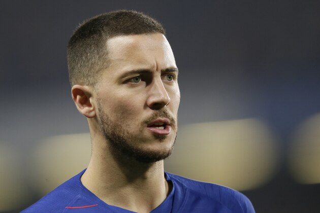 Chelsea's Eden Hazard stands during the English Premier League soccer match between Chelsea and Tottenham Hotspur at Stamford Bridge stadium, in London, dow}, Feb. 27, 2019. (AP Photo/Tim Ireland)