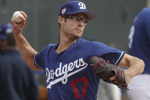 Los Angeles Dodgers' Joe Kelly throws during a spring training baseball workout Wednesday, Feb. 13, 2019, in Glendale, Ariz. (AP Photo/Morry Gash)