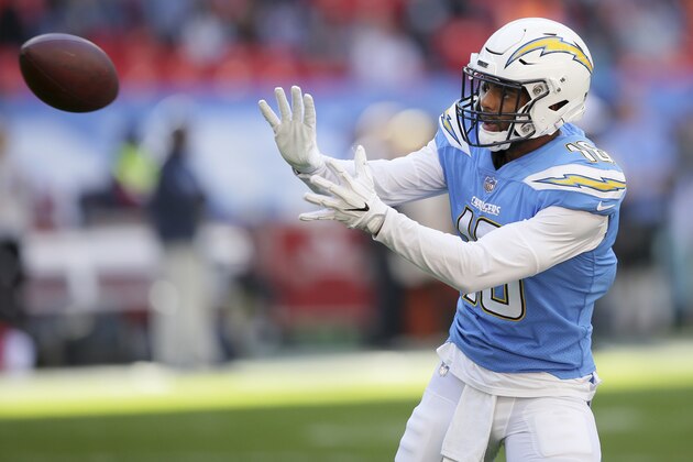 Los Angeles Chargers wide receiver Tyrell Williams (16) catches the ball as he warms-up before an NFL football game against Tennessee Titans at Wembley stadium in London, Sunday, Oct. 21, 2018. (AP Photo/Tim Ireland)