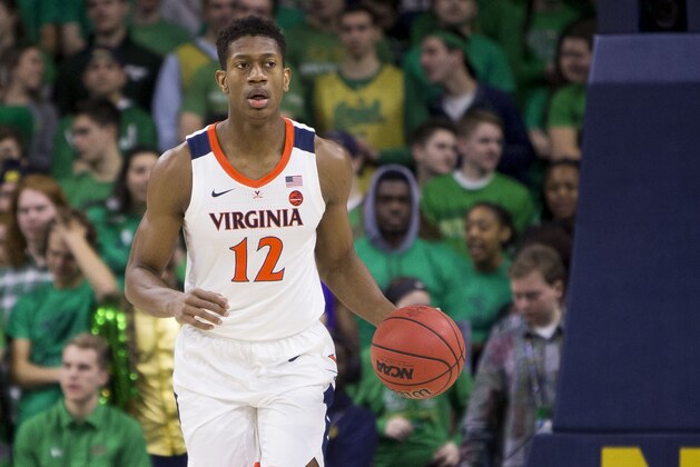 Virginia's De'Andre Hunter (12) brings the ball downcourt during an NCAA college basketball game against Notre Dame Saturday, Jan. 26, 2019, in South Bend, Ind. Virginia won 82-55. (AP Photo/Robert Franklin)