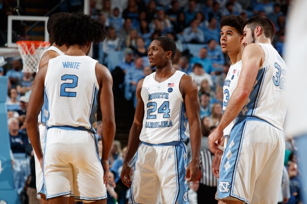 CHAPEL HILL, NC - FEBRUARY 26: Coby White #2, Garrison Brooks #15, Kenny Williams #24, Luke Maye #32 and Cameron Johnson #13 of the North Carolina Tar Heels huddle during a game against the Syracuse Orange on February 26, 2019 at the Dean Smith Center in Chapel Hill, North Carolina. North Carolina won 93-85. (Photo by Peyton Williams/UNC/Getty Images)