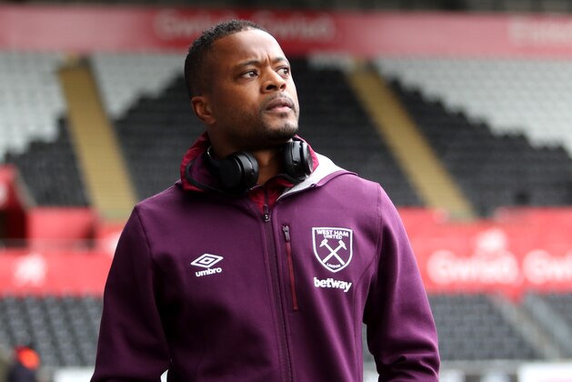 SWANSEA, WALES - MARCH 03: Patrice Evra of West Ham United arrives prior to the Premier League match between Swansea City and West Ham United at Liberty Stadium on March 3, 2018 in Swansea, Wales.  (Photo by Christopher Lee/Getty Images)