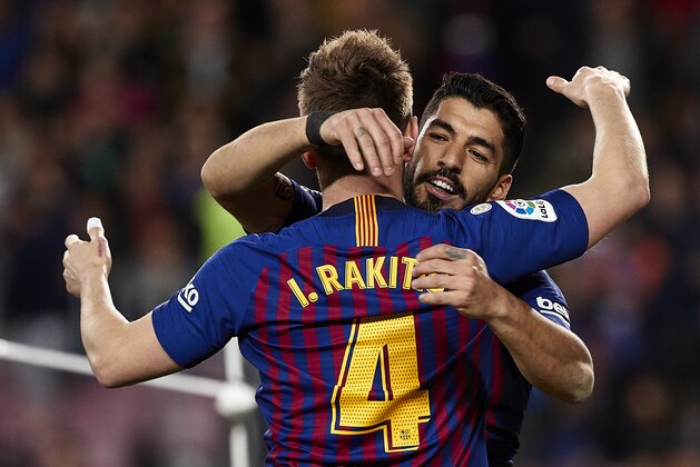 BARCELONA, SPAIN - MARCH 09: Luis Suarez and Ivan Rakitic of FC Barcelona celebrating their team's third goal during the La Liga match between FC Barcelona and Rayo Vallecano de Madrid at Camp Nou on March 09, 2019 in Barcelona, Spain. (Photo by Quality Sport Images/Getty Images)