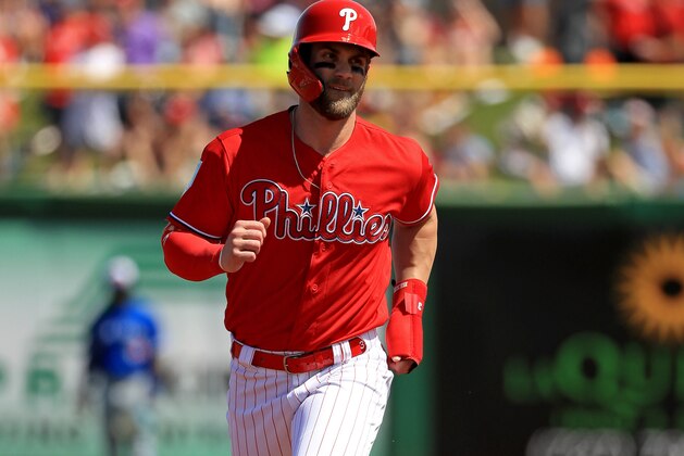 CLEARWATER, FLORIDA - MARCH 09: Bryce Harper #3  scores on a two run home run in the first inning by Rhys Hoskins #17 of the Philadelphia Phillies during a game against the Toronto Blue Jays on March 09, 2019 in Clearwater, Florida. (Photo by Mike Ehrmann/Getty Images)