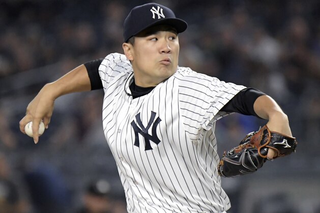 New York Yankees pitcher Masahiro Tanaka delivers the ball to the Toronto Blue Jays during the first inning of a baseball game Friday, Sept.14, 2018, at Yankee Stadium in New York. (AP Photo/Bill Kostroun)