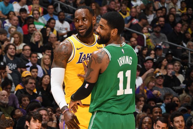 LOS ANGELES, CA - MARCH 9: LeBron James #23 of the Los Angeles Lakers and Kyrie Irving #11 of the Boston Celtics smile during a game on March 9, 2019 at STAPLES Center in Los Angeles, California. NOTE TO USER: User expressly acknowledges and agrees that, by downloading and/or using this Photograph, user is consenting to the terms and conditions of the Getty Images License Agreement. Mandatory Copyright Notice: Copyright 2019 NBAE (Photo by Andrew D. Bernstein/NBAE via Getty Images)