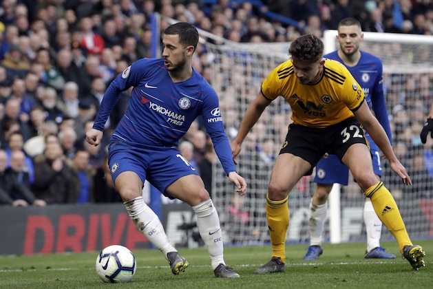 Chelsea's Eden Hazard, left, is challenged by Wolverhampton Wanderers' Leander Dendoncker during the English Premier League soccer match between Chelsea and Wolverhampton Wanderers at Stamford Bridge stadium in London, Sunday, March 10, 2019. (AP Photo/Matt Dunham)