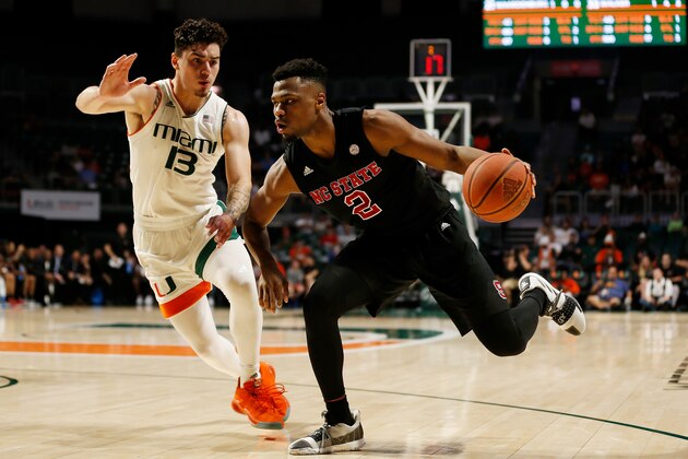 MIAMI, FL - JANUARY 03:  Torin Dorn #2 of the North Carolina State Wolfpack drives to the basket against Anthony Mack #13 of the Miami Hurricanes during the first half at Watsco Center on January 3, 2019 in Miami, Florida.  (Photo by Michael Reaves/Getty Images)
