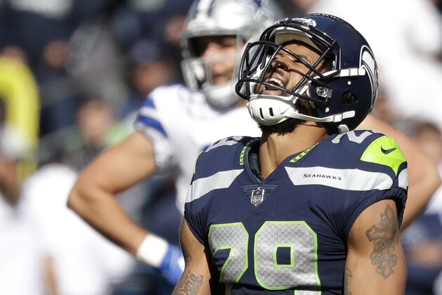 Seattle Seahawks free safety Earl Thomas (29) celebrates after he tackled Dallas Cowboys running back Ezekiel Elliott during the first half of an NFL football game, Sunday, Sept. 23, 2018, in Seattle. (AP Photo/Elaine Thompson)