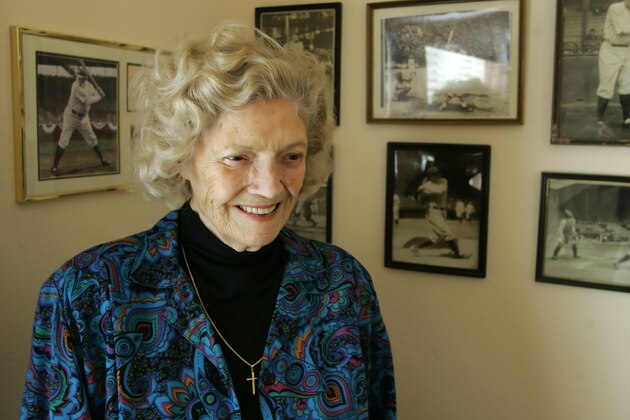 Julia Ruth Stevens, daughter of Babe Ruth, stands by photographs of her father at her home in Sun City, Ariz., Sunday March 26, 2006.(AP Photo/Eric Risberg)