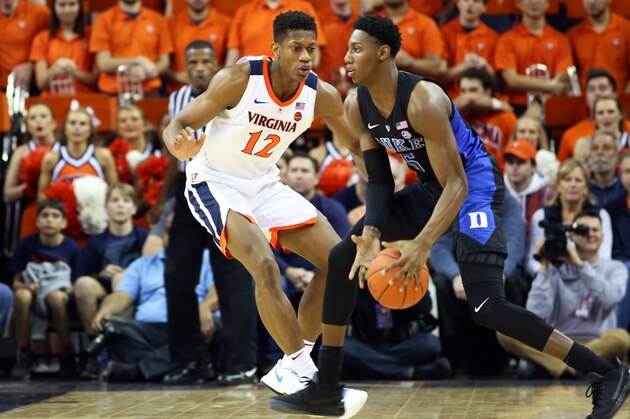 CHARLOTTESVILLE, VA - FEBRUARY 09: De'Andre Hunter #12 of the Virginia Cavaliers defends RJ Barrett #5 of the Duke Blue Devils in the second half during a game at John Paul Jones Arena on February 9, 2019 in Charlottesville, Virginia. (Photo by Ryan M. Kelly/Getty Images)