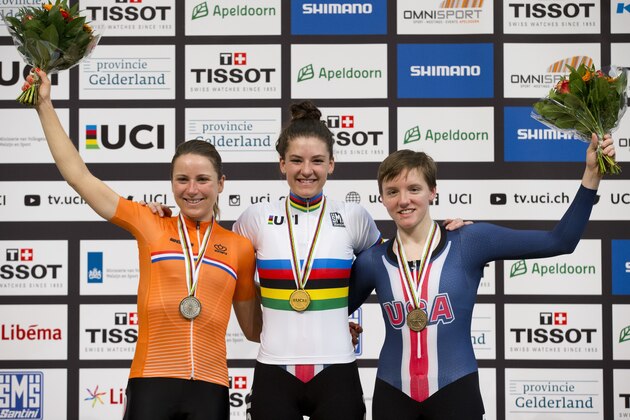 World champion and new world record holder Chloe Dygert of the U.S., center, silver medalist Annemiek van Vleuten of The Netherlands, left, and bronze medalist Kelly Catlin of the U.S., right, pose with their medals on the podium of the women's individual pursuit at the World Championships Track Cycling in Apeldoorn, eastern Netherlands, Netherlands, Saturday, March 3, 2018. (AP Photo/Peter Dejong)