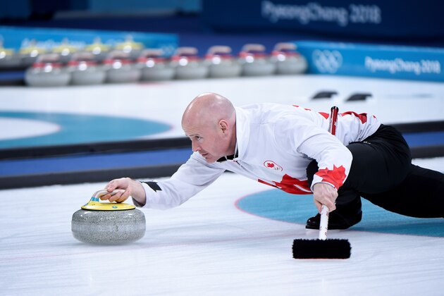 Canada's Kevin Koe throws the stone during the curling men's bronze medal game during the Pyeongchang 2018 Winter Olympic Games at the Gangneung Curling Centre in Gangneung on February 23, 2018. / AFP PHOTO / WANG Zhao        (Photo credit should read WANG ZHAO/AFP/Getty Images)