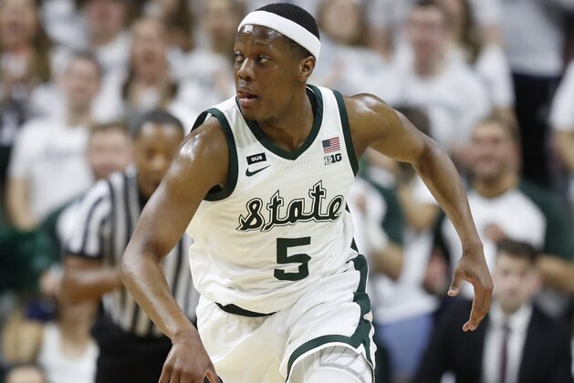 Michigan State guard Cassius Winston brings the ball up court during the first half of an NCAA college basketball game against Michigan, Saturday, March 9, 2019, in East Lansing, Mich. (AP Photo/Carlos Osorio)