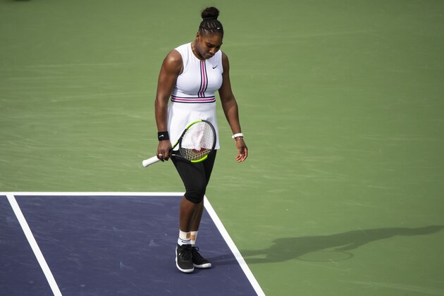 INDIAN WELLS, CALIFORNIA - MARCH 10: Serena Williams of the United States walks back to her chair to receive medical attention for a viral infection during her match against Garbine Muguruza of Spain in the second round of the BNP Paribas Masters on March 10, 2019 at the Indian Wells Tennis Garden in Indian Wells, California. (Photo by TPN/Getty Images)