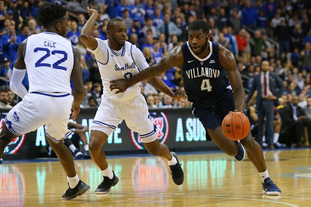 NEWARK, NJ - MARCH 09: Eric Paschall #4 of the Villanova Wildcats in action against Myles Cale #22 and Quincy McKnight #0 of the Seton Hall Pirates during a college basketball game at Prudential Center on March 9, 2019 in Newark, New Jersey. Seton Hall defeated Villanova 79-75. (Photo by Rich Schultz/Getty Images)