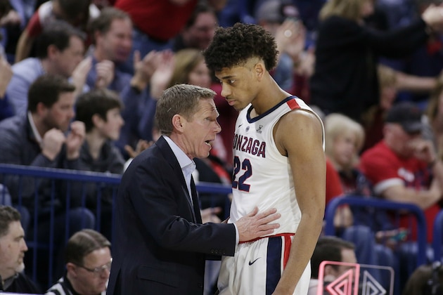 Gonzaga head coach Mark Few, left, speaks with forward Jeremy Jones during the second half of an NCAA college basketball game against BYU in Spokane, Wash., Saturday, Feb. 23, 2019. (AP Photo/Young Kwak)
