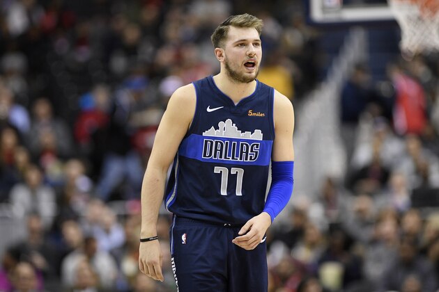 Dallas Mavericks forward Luka Doncic (77) reacts during the first half of an NBA basketball game against the Washington Wizards, Wednesday, March 6, 2019, in Washington. (AP Photo/Nick Wass)