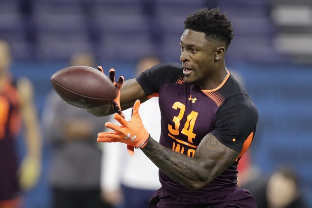 Mississippi wide receiver D.K. Metcalf runs a drill during the NFL football scouting combine, Saturday, March 2, 2019, in Indianapolis. (AP Photo/Darron Cummings)