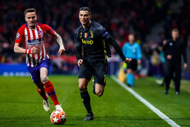 MADRID, SPAIN - FEBRUARY 20: Saul Niguez of Atletico Madrid and Cristiano Ronaldo of Juventus battle for the ball during the UEFA Champions League Round of 16 First Leg match between Club Atletico de Madrid and Juventus at Estadio Wanda Metropolitano on February 20, 2019 in Madrid, Spain. (Photo by TF-Images/TF-Images via Getty Images)