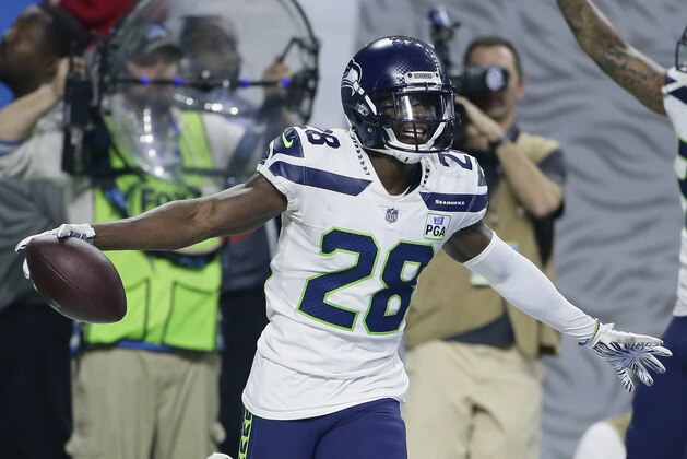 Seattle Seahawks cornerback Justin Coleman (28) celebrates after intercepting a pass from Detroit Lions quarterback Matthew Stafford (9) during the fourth quarter of an NFL football game, Sunday, Oct. 28, 2018, in Detroit. (AP Photo/Duane Burleson)