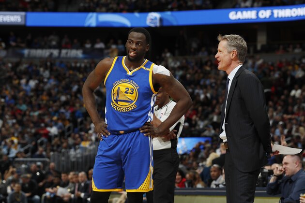 Golden State Warriors forward Draymond Green (23) and Golden State Warriors head coach Steve Kerr in the first half of an NBA basketball game Monday, Feb. 13, 201, in Denver. (AP Photo/David Zalubowski)